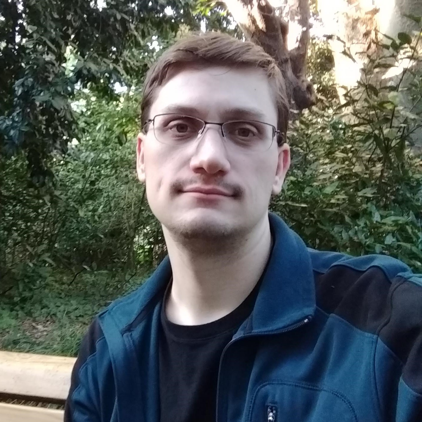 Alexander Foerster standing in front of Takeshita Street in Tokyo Japan.